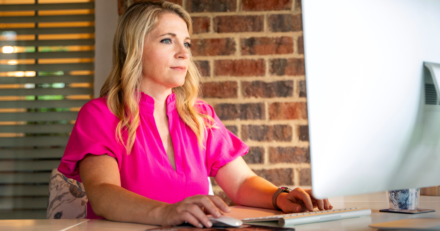 Amanda, a TZIELD® (teplizumab-mzwv) caregiver, sitting at a desk on a computer