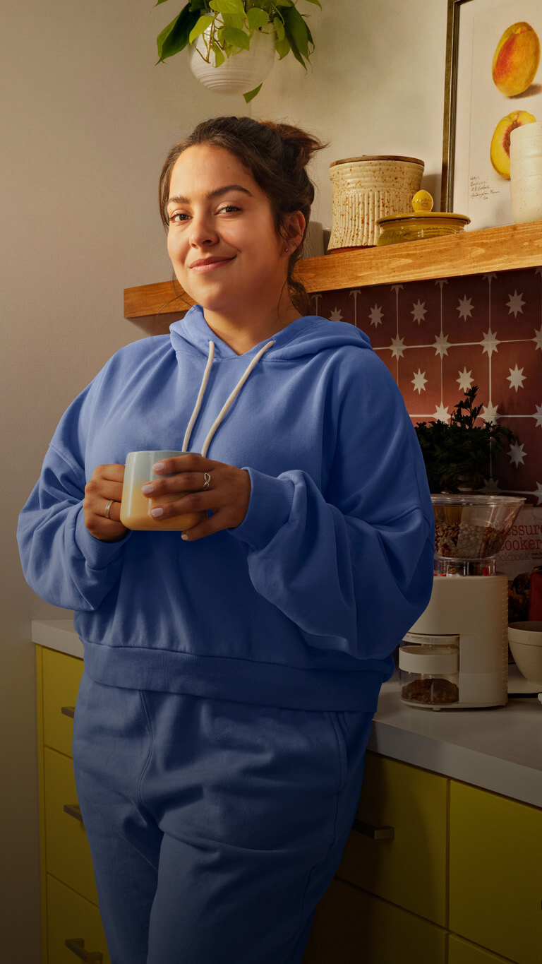 Image of young adult woman drinking coffee